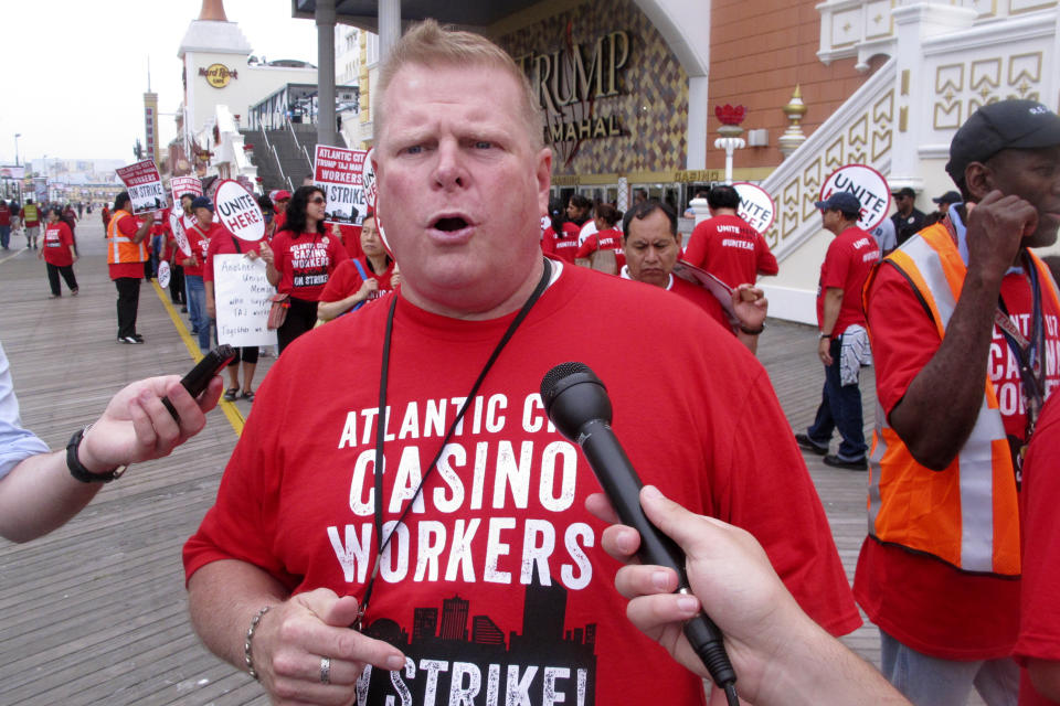 FILE - In this July 1, 2016 file photo, Bob McDevitt, left, president of Local 54 of the Unite Here casino workers union, speaks to reporters outside the Trump Taj Mahal casino in Atlantic City N.J. hours after the union went on strike against the casino. McDevitt is stepping down as president of the main Atlantic City casino workers union, Local 54 of Unite Here, after 26 years as one of the most powerful people in Atlantic City. On May 1, 2023, he'll become head of the union's national pension plan. (AP Photo/Wayne Parry, File)