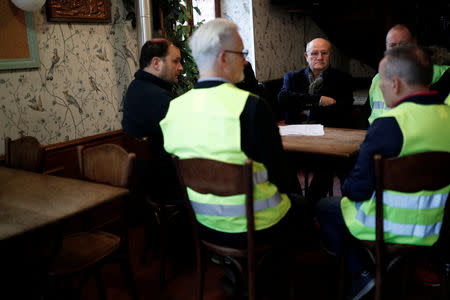 FILE PHOTO: Jacques Drouhin, mayor of Flagy, speaks with yellow vests movement members at a cafe in Flagy, France, January 9, 2019. Picture taken January 9, 2019. REUTERS/Benoit Tessier/File Photo