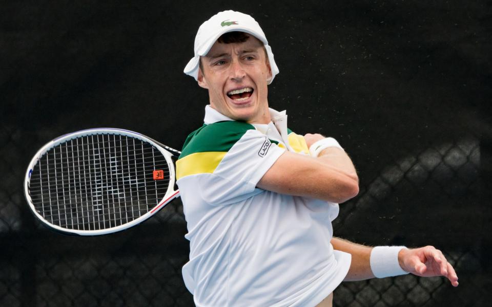 Marc Polmans of Australia plays a forehand against Mark Whitehouse of Great Britain during the 2022 NSW Open quarterfinals match at Sydney Olympic Park Tennis Centre on November 04, 2022 in Sydney, Australia