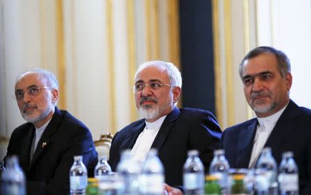 Iranian Foreign Minister Mohammad Javad Zarif (C), Head of the Iranian Atomic Energy Organization Ali Akbar Salehi and Hossein Fereydoon (R), brother and close aide to President Hassan Rouhani meet with U.S. Secretary of State John Kerry (not pictured) at a hotel in Vienna, Austria July 3, 2015. REUTERS/Carlos Barria