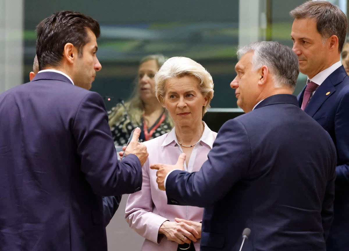 Bulgaria’s prime minister, Kiril Petkov, speaks with president of the European Commission Ursula von der Leyen, Hungary’s prime minister, Viktor Orban, and Slovakia’s prime minister, Eduard Heger, in Brussels  (AFP via Getty Images)