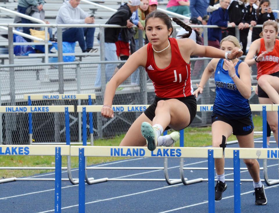 Rosalinda Gascho runs in the 100-meter hurdles during the MHSAA Region 31-4 track meet on Friday, May 19 in Indian River, Mich.