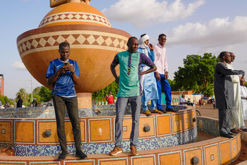 Supporters of Nigerien President Mohamed Bazoum gather in his support in Niamey, Niger, Wednesday July 26 2023. Governing bodies in Africa condemned what they characterized as a coup attempt Wednesday against Niger's president, whose official Twitter account reported that elements of the presidential guard engaged in an "anti-Republican demonstration" and tried to obtain the support of other security forces. (AP Photo/Sam Mednick)