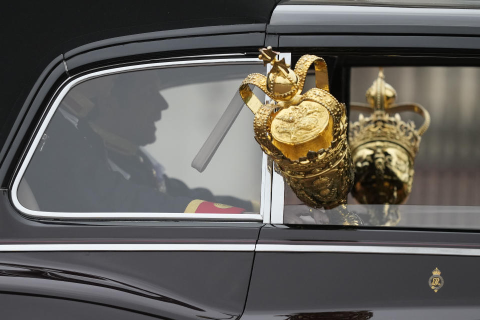 Cars carrying the crown leave Buckingham Palace for the State Opening of Parliament, at the Palace of Westminster in London, Tuesday, May 10, 2022. Buckingham Palace said Queen Elizabeth II will not attend the opening of Parliament on Tuesday amid ongoing mobility issues. (AP Photo/Frank Augstein)