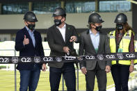 Q2 Holdings Inc. CEO Matt Flake, left, and Austin FC majority owner Anthony Precourt, second from left, take part in a ribbon cutting as the team's new stadium is named Q2 Stadium, Monday, Jan. 25, 2021, in Austin, Texas. (AP Photo/Eric Gay)