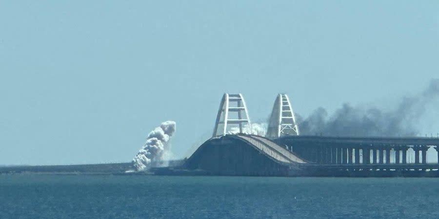 Crimea Bridge closed after explosions, wreathed in dense white smoke