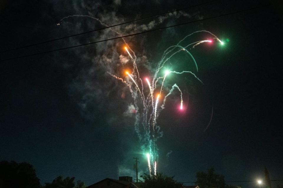 Illegal fireworks explode in the sky above a residential area after the July Fourth holiday in Sacramento. Sacramento Fire Department spokesman Justin Sylvia said fines for use of illegal fireworks start at $1,000 and can go up to $5,000.