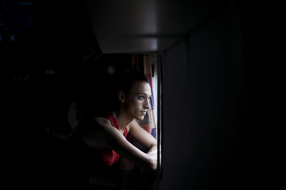 Soccer player Mara Gomez poses for a portrait at her home in La Plata, Argentina, Thursday, Feb. 6, 2020. Gomez is a transgender woman who is limited to only training with her women's professional soccer team, Villa San Carlos. She is waiting for confirmation from the Argentina Football Association (AFA) she can play. (AP Photo/Natacha Pisarenko)