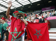 Morocco fans cheer before their team's match against Spain in the men's Group D football match at the London 2012 Olympic Games at Old Ttrattford in Manchester August 1, 2012. REUTERS/Andrea Comas (BRITAIN - Tags: SPORT SOCCER SPORT OLYMPICS) 