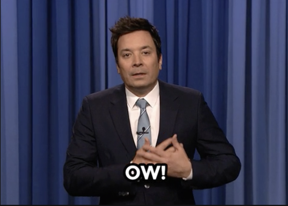 jimmy fallon holding his chest saying "ow!"