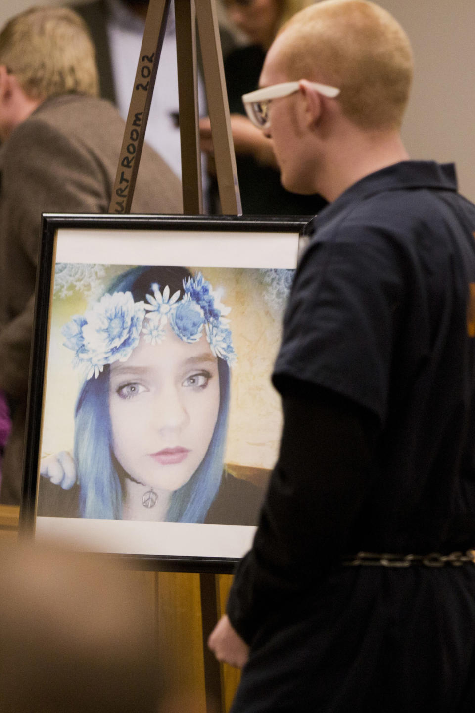 Tyerell Joe Przybycien walks by a photo of Jchandra Brown in the 4th District Court during his sentencing on Dec. 7, 2018, in Provo, Utah.&nbsp; (Photo: ASSOCIATED PRESS)