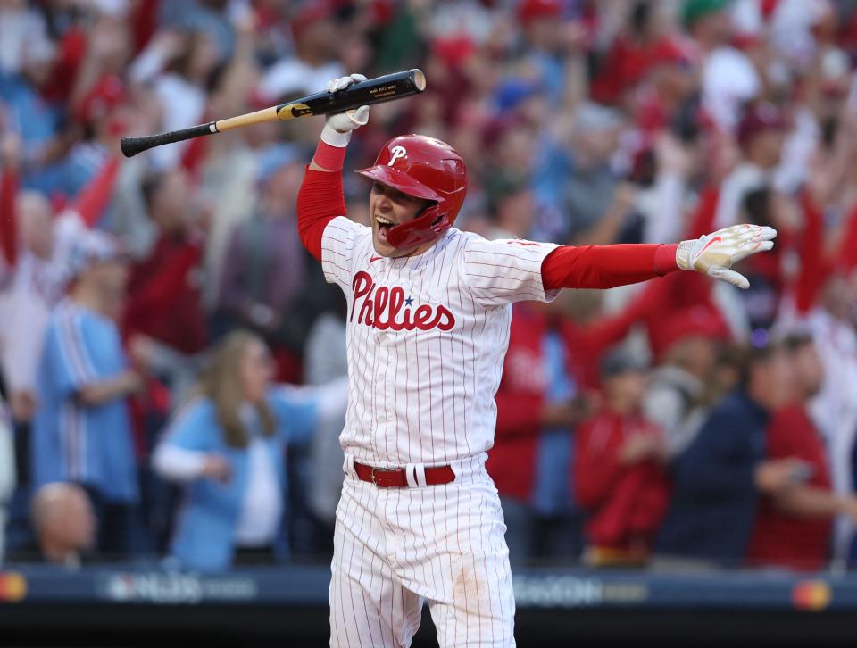 Rhys Hoskins celebrates his three-run homer in game 3 of the National League Division Series against the Atlanta Braves.