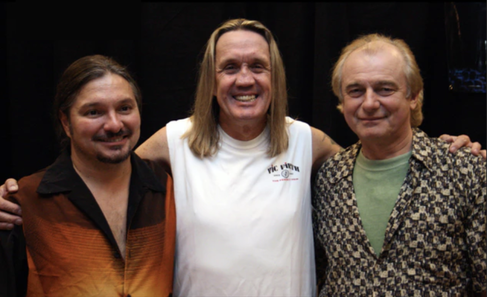 Iron Maiden drummer Nicko McBrain poses with Alan White of Yes (on right) and a happy camper (left) at Rock 'n' Roll Fantasy Camp in 2007.