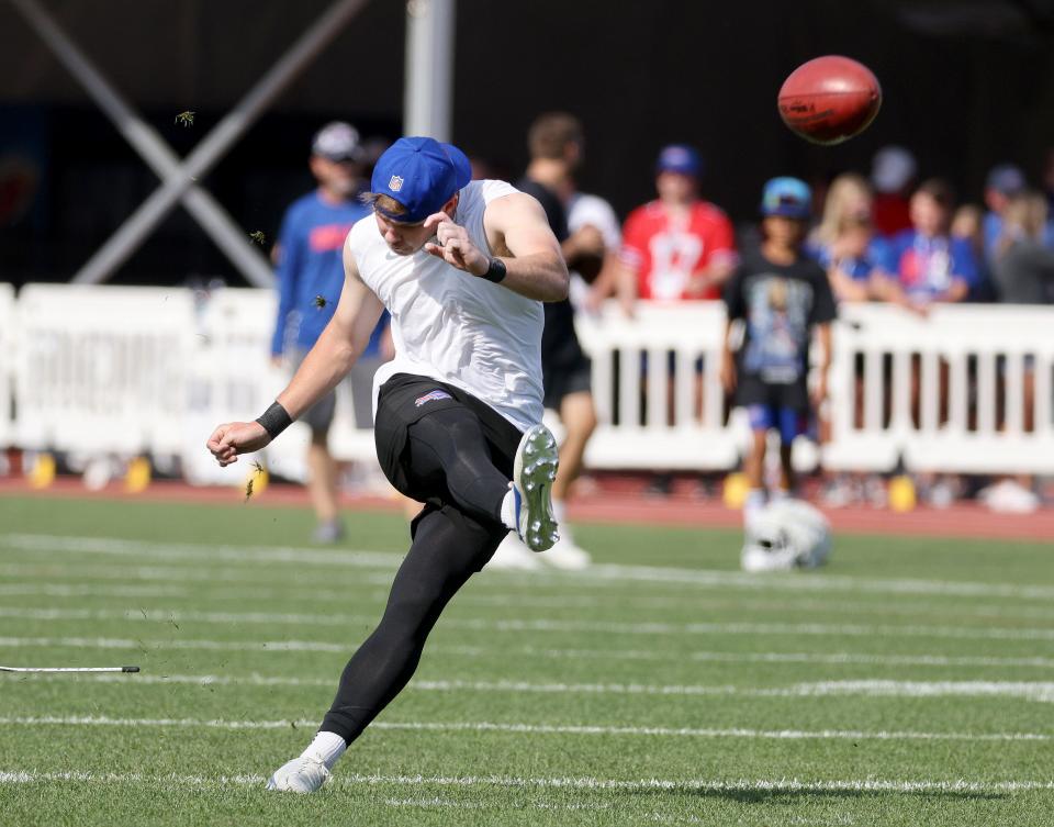 Tyler Bass gets some work in on kickoffs before the start of practice Sunday morning.