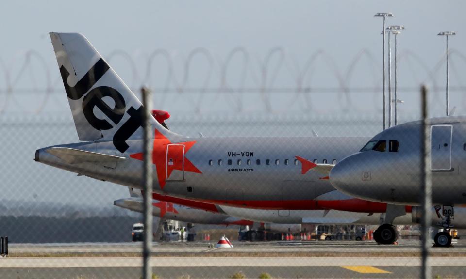 <span>The passenger left the plane through an emergency exit and made his way to the ground at Melbourne airport, a Jetstar spokeswoman said.</span><span>Photograph: Jono Searle/AAP</span>