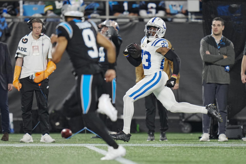 Indianapolis Colts cornerback Kenny Moore II runs for a touchdown past Carolina Panthers quarterback Bryce Young after an interception during the second half of an NFL football game Sunday, Nov. 5, 2023, in Charlotte, N.C. (AP Photo/Rusty Jones)