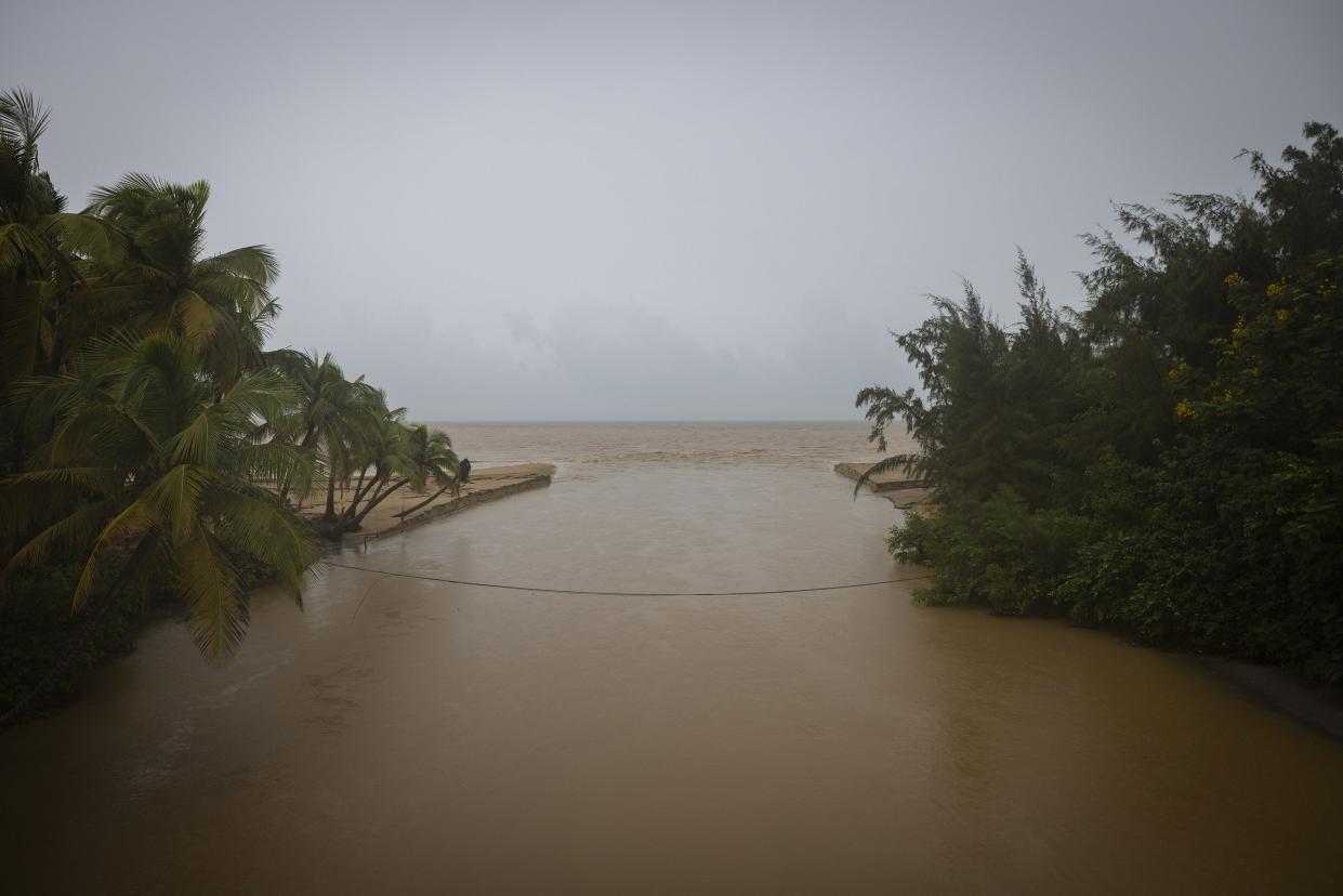 The mouth of the Rio Grande River reaches its banks after the passing of Hurricane Fiona in Loiza, Puerto Rico, Monday, Sept. 19, 2022.