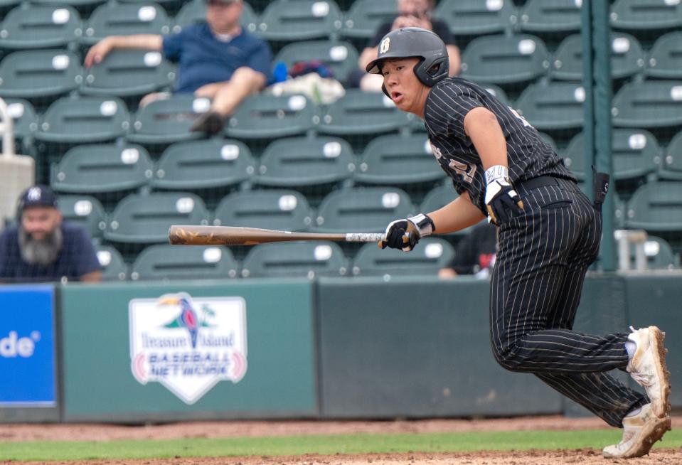 Buchholz Kai So(19) watchs the ball as he runs to first base ending up with a double in the forth inning of their game with Bloomingdale in a high school class 6A semi final baseball game on Wednesday, May 16, 2024, in Fort Myers, Fla. (Photo/Chris Tilley)