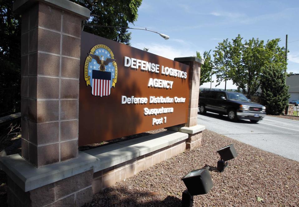 Vehicle passes through the front entrance of the the Defense Logistics Agency's huge storage facility outside Harrisburg, Pennsylvania