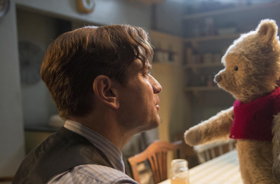 This image released by Disney shows Ewan McGregor, left, with Winnie-the-Pooh in a scene from "Christopher Robin." A.A. Milne’s 1926 book, “Winnie-the-Pooh,” with illustrations by E.H. Shepard, became public domain on January 1 when the copyright expired. (Laurie Sparham/Disney via AP)