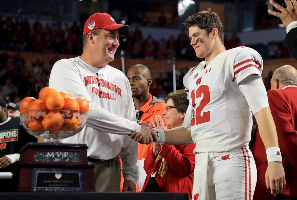 Head coach Paul Chryst and Alex Hornibrook celebrate after winning the 2017 Capital One Orange Bowl.