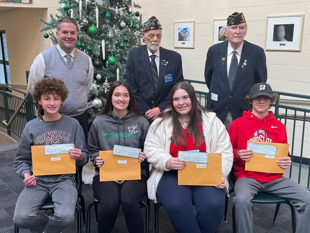 Winners of the annual Americanism and Government Program are, from left: back row - Casey Wright, Principal; Dave Pristash, Post 801 Commander;  and John JC Sullivan, Program Chair; and front row, 10th graders William Lang and  Sarah Hermann; and 11th graders  Owen Tyndal and Taylor Hawkins. Not pictured are 12th grader Caterina  Pradella and Steve Testa, high school test administrator. The program was sponsored by the American Legion Nordonia Hills Post 801 and the American Legion Auxiliary Unit 801.