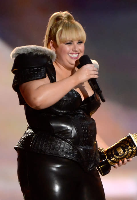 Rebel Wilson didn't just host the awards she also won one winning Best Breakthrough performance for 'Pitch Perfect'. She said "I only do this for the awards. That and cash money," says Rebel. "The only thing that would make this better is if Zac Effron took off his shirt right now and came and kissed me".