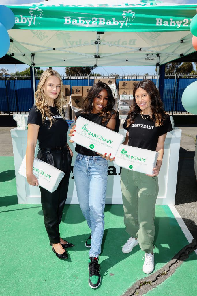 (L-R): Baby2Baby Co-CEO Kelly Sawyer Patricof, Kelly Rowland and Baby2Baby Co-CEO Norah Weinstein attend Baby2Baby’s B2B Safe Distribution event in Los Angeles on March 19, 2022. - Credit: Phillip Faraone/Getty Images