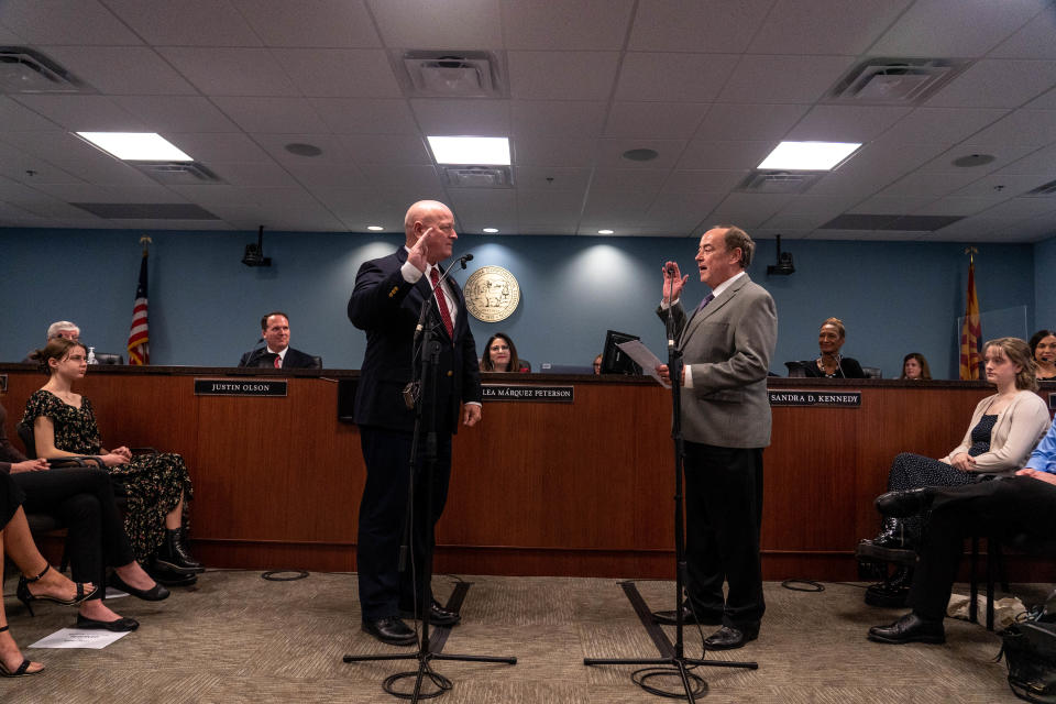 Kevin Thompson (left) is sworn in as a commissioner of the Arizona Corporation Commission, by Arizona Supreme Court Justice Clint Bolick (right) during a swearing-in ceremony at The Arizona Corporation Commission building in Phoenix on Jan. 3, 2023.