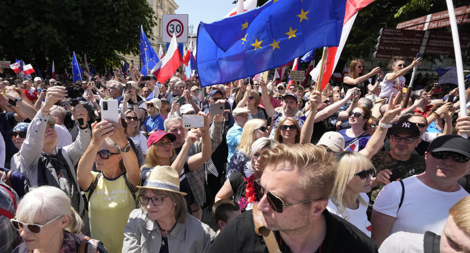 Participants join an anti-government march led by the centrist opposition party leader Donald Tusk, who along with other critics accuses the government of eroding democracy, in Warsaw, Poland, Sunday, June 4, 2023. Poland's largest opposition party led a march Sunday meant to mobilize voters against the right-wing government, which it accuses of eroding democracy and following Hungary and Turkey down the path to autocracy. The march is being held on the 34th anniversary of the first partly free elections, a democratic breakthrough in the toppling of communism across Eastern Europe. (AP Photo/Czarek Sokolowski)