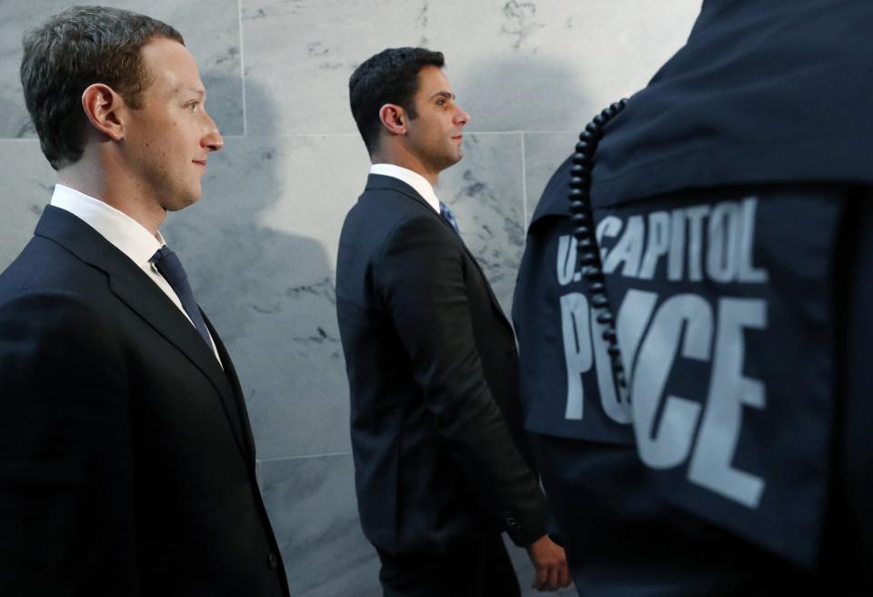 Mark Zuckerberg walks towards an exit after his meeting with Senate Judiciary Committee Chairman Chuck Grassley (R-IA), whose committee will be part of a joint hearing on how Facebook handles user data, on Capitol Hill in Washington, U.S., April 9, 2018. REUTERS/Leah Millis