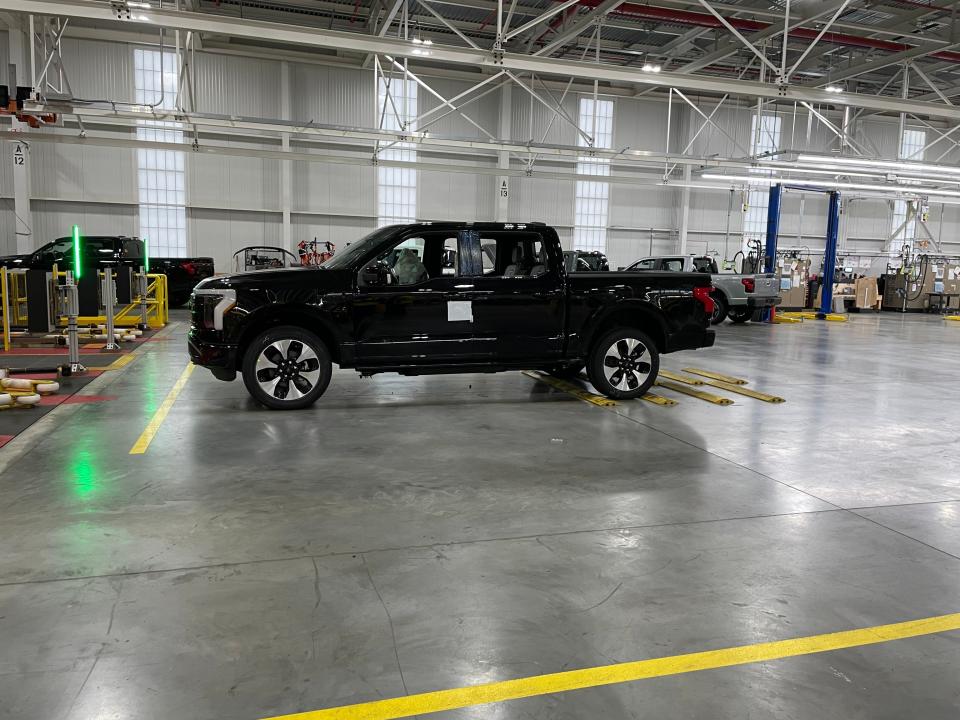 A completed F-150 Lightning awaits charging.