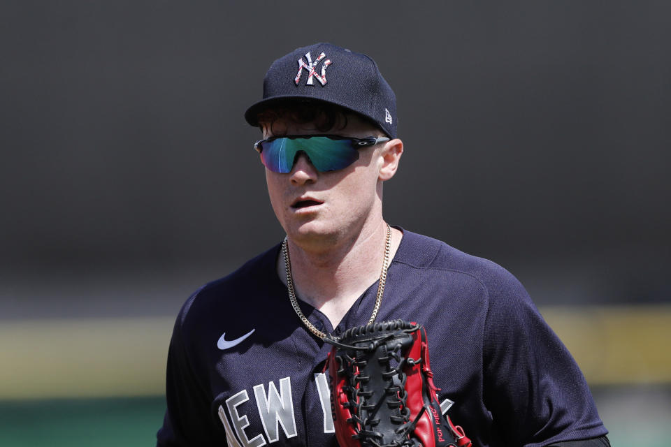 FILE - In this March 9, 2020, file photo, New York Yankees' Clint Frazier runs to the dugout during a spring training baseball game in Clearwater, Fla. Brett Gardner's return to the Yankees won't displace Clint Frazier from taking over as New York's starting left fielder. Manager Aaron Boone said Saturday, Feb. 20, 2021, that the 26-year-old Frazier remained his first choice in left while cautioning developments during a season could alter intentions. (AP Photo/Carlos Osorio, File)