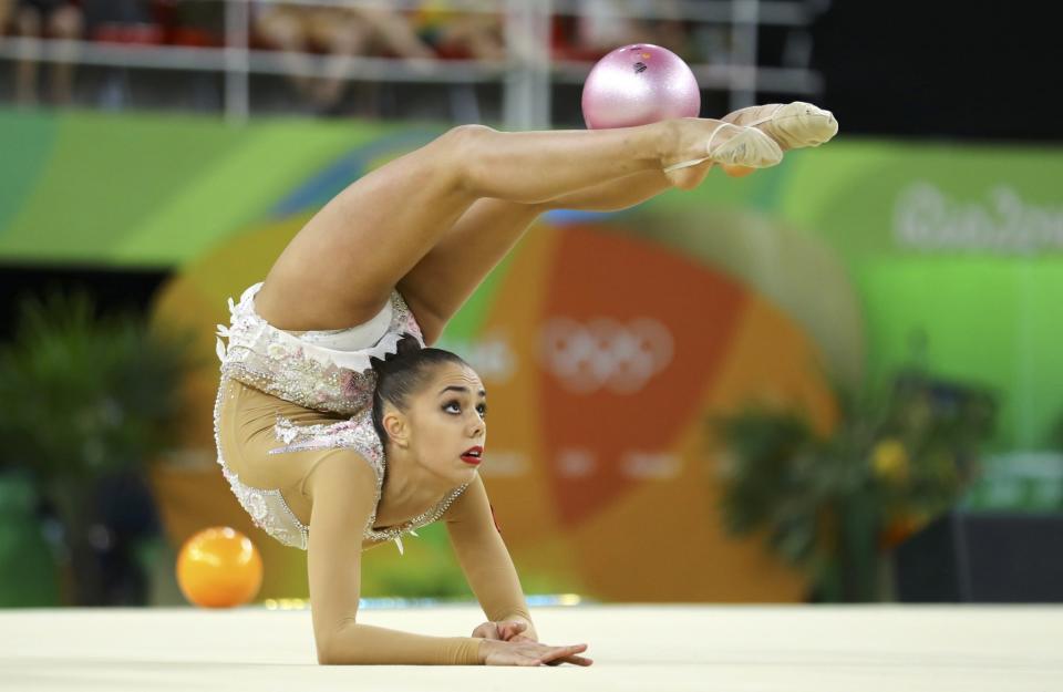 <p>Margarita Mamun (RUS) of Russia competes using the ball. </p>