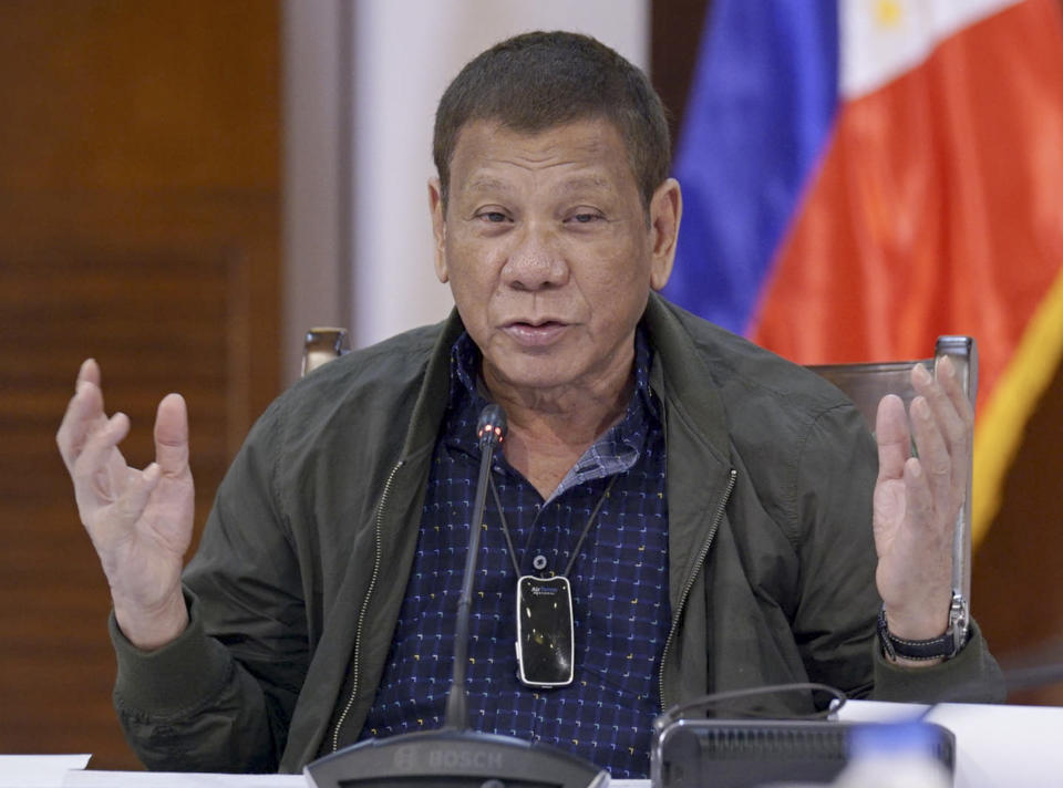 In this photo provided by the Malacanang Presidential Photographers Division, Philippine President Rodrigo Duterte discusses issues related to the new coronavirus during a meeting with members of the Inter-Agency Task Force on the Emerging Infectious Diseases (IATF-EID) at the presidential guest house in Panacan, Davao City, southern Philippines on Tuesday July 7, 2020. (Arman Baylon/Malacanang Presidential Photographers Division via AP)