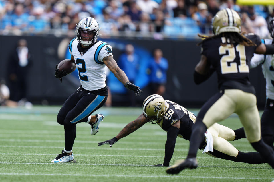 Carolina Panthers wide receiver DJ Moore (2) runs the ball against New Orleans Saints cornerback P.J. Williams (26) during the second half of an NFL football game,Sunday, Sept. 25, 2022, in Charlotte, N.C. (AP Photo/Jacob Kupferman)