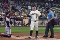 Milwaukee Brewers' Luis Urias reacts after hitting a home run during the third inning of a baseball game against the Arizona Diamondbacks Tuesday, Oct. 4, 2022, in Milwaukee. (AP Photo/Morry Gash)