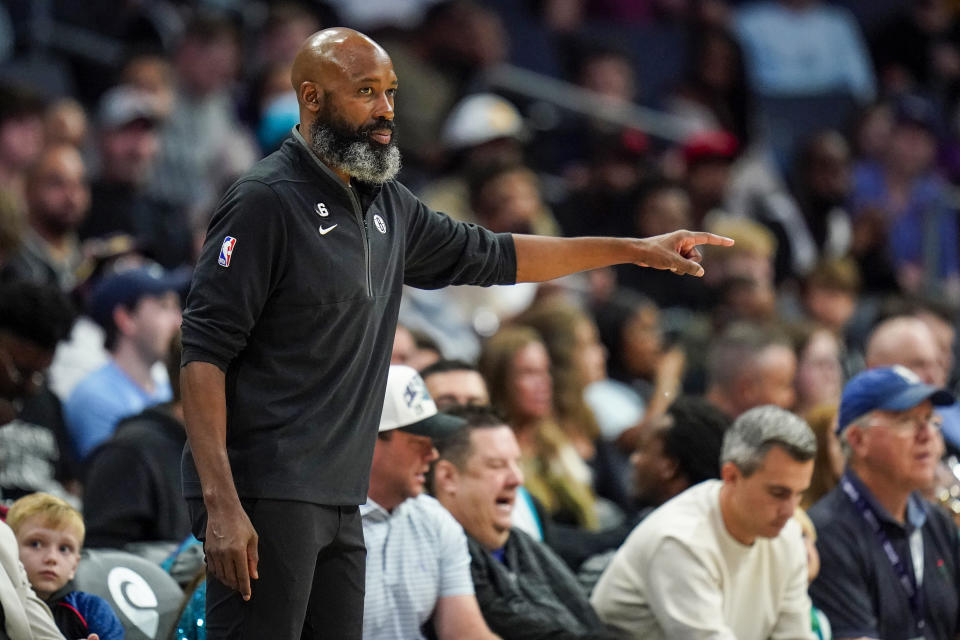 Brooklyn Nets interim head coach Jacque Vaughn gives direction to his team during the first half of an NBA basketball game against the Charlotte Hornets, Saturday, Nov. 5, 2022, in Charlotte, N.C. (AP Photo/Rusty Jones)