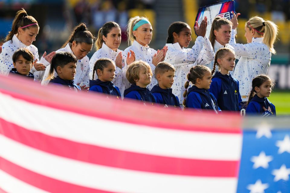 Jul 27, 2023; Wellington, NZL; The United States women's national team claps at the conclusion of the national anthem before a group stage match against the Netherlands in the 2023 FIFA Women's World Cup at Wellington Regional Stadium. Mandatory Credit: Jenna Watson-USA TODAY Sports
