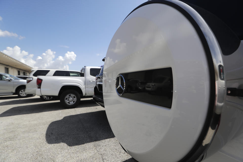 A Mercedes-Benz SUV sits among vehicles worth an estimated $3.2 million, at Port Everglades after they were seized by Homeland Security Investigations, Wednesday, July 8, 2020, in Fort Lauderdale, Fla. The vehicles were to be smuggled to Venezuela in violation of U.S. export laws and sanctions against the socialist Venezuelan Government. (AP Photo/Lynne Sladky)