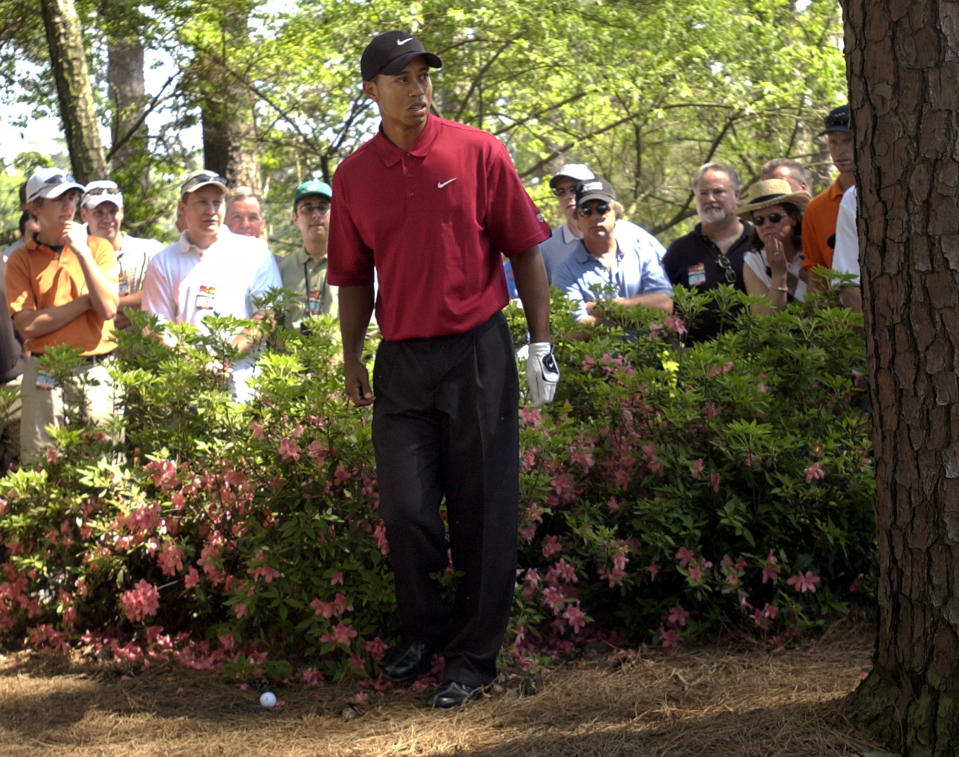 <p>Tiger Woods checks his shot after getting in trouble on the third hole during final round play of the 2003 Masters at the Augusta National Golf Club in Augusta, Ga., Sunday, April 13, 2003. (AP Photo/David J. Phillip) </p>