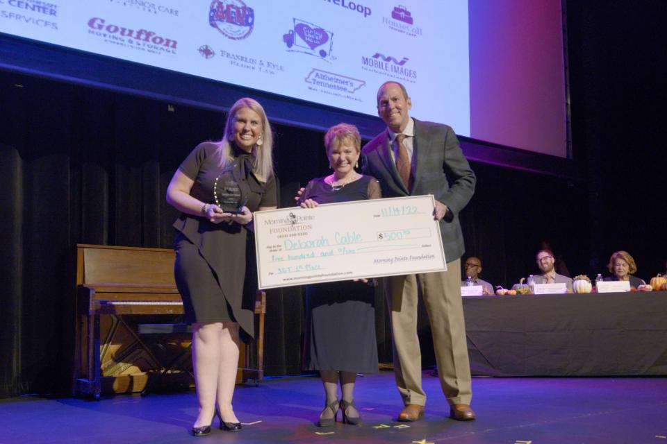 The Morning Pointe Foundation will present its third annual Knoxville Seniors Got Talent variety show at the Bijou on Nov. 14, 2023. Here’s pianist Deborah Cable with her grand prize in last year’s competition, with Miranda Perez, Morning Pointe Foundation executive director, left, and Franklin Farrow, Morning Pointe Senior Living co-founder and CEO.