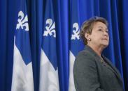 Parti Quebecois leader Pauline Marois speaks to the media during a campaign stop in Montreal March 30, 2014. Quebec voters will go to the polls in a provincial election April 7. REUTERS/Christinne Muschi (CANADA - Tags: POLITICS ELECTIONS)