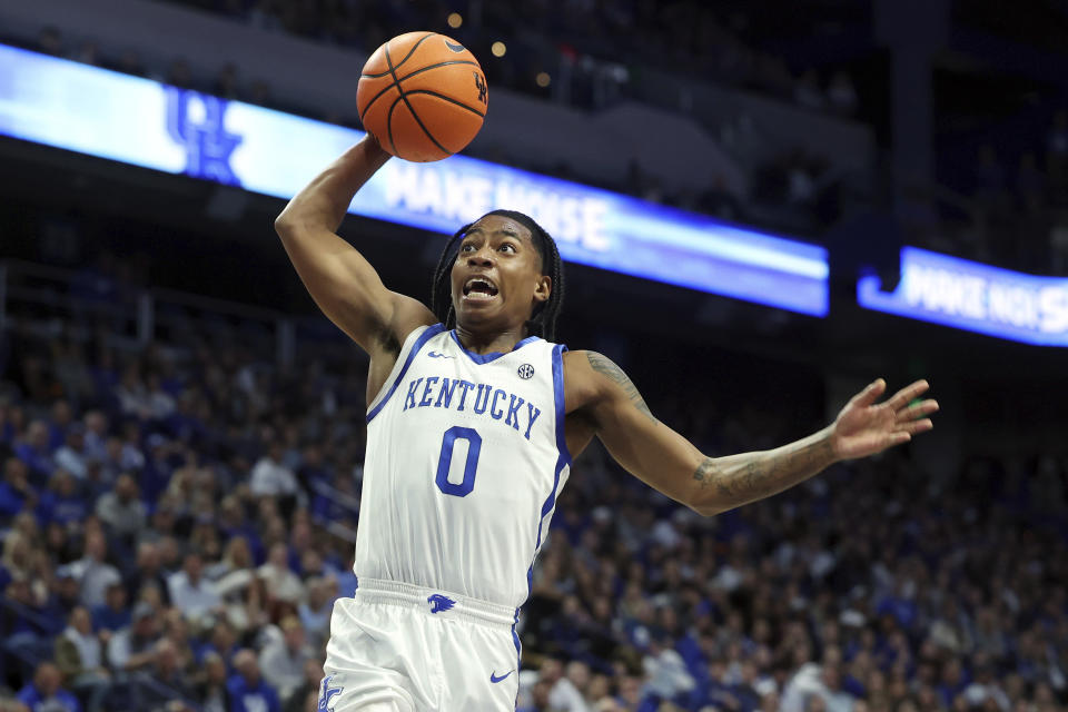 Kentucky's Rob Dillingham goes up for a dunk during the first half of the team's NCAA college basketball game against Texas A&M-Commerce in Lexington, Ky., Friday, Nov. 10, 2023. (AP Photo/James Crisp)