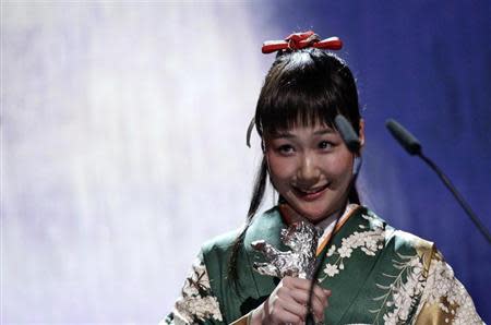 Japanese actress Haru Kuroki reacts as she won the Silver Bear award for best actress during the awards ceremony of the 64th Berlinale International Film Festival in Berlin February 15, 2014. REUTERS/Tobias Schwarz