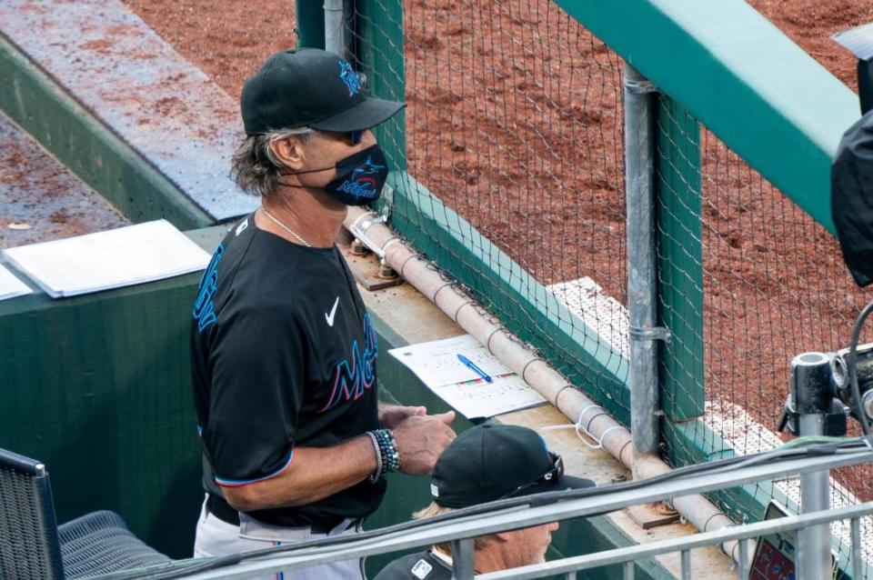 Miami Marlins’ manager Don Mattingly looks out from the dugout during the eighth inning of a baseball game against the Philadelphia Phillies, Saturday, July 25, 2020, in Philadelphia.