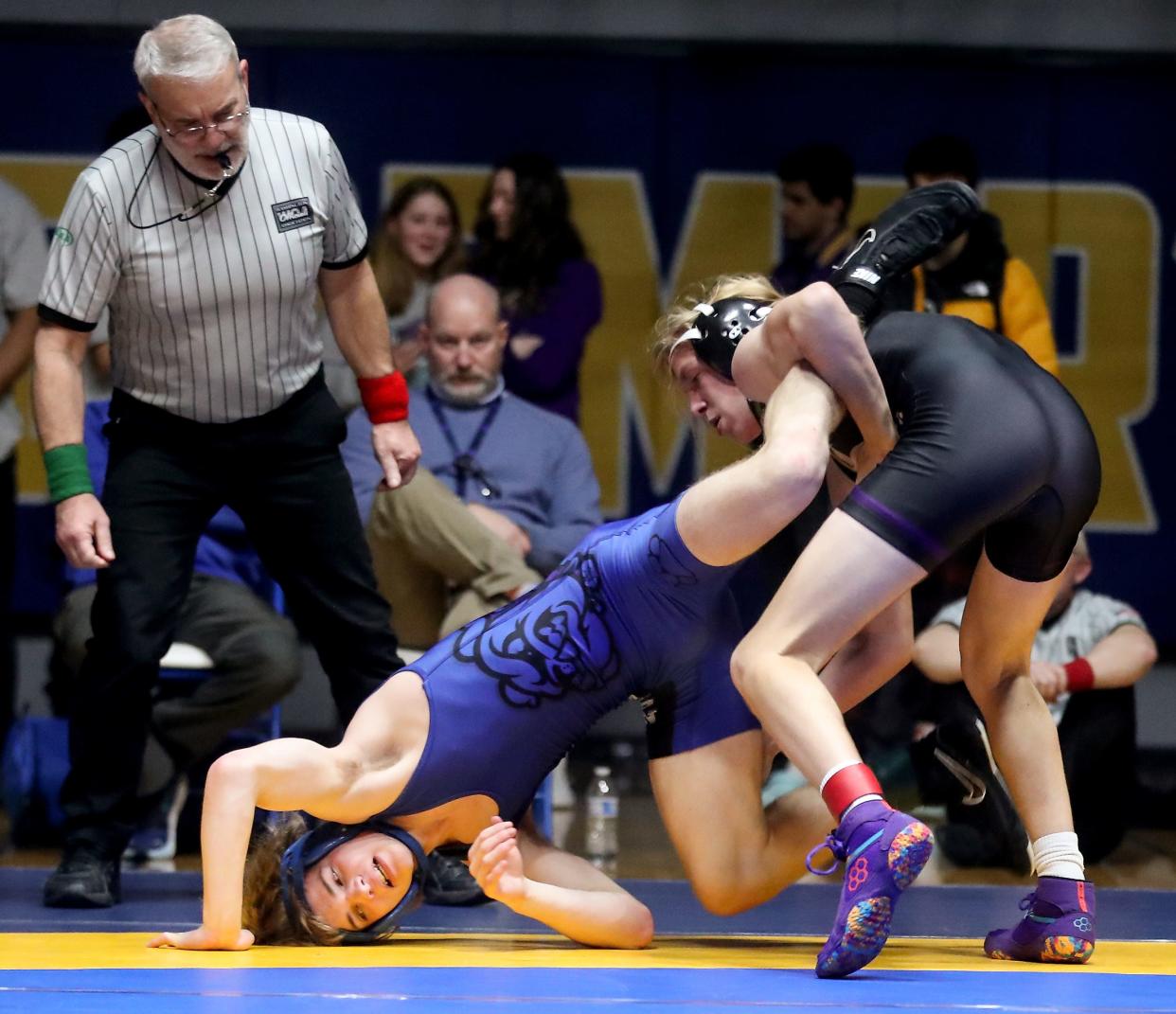 North Kitsap's Wyatt Trogden wrestles North Mason's Blake Evans during their 126-pound bout for the Olympic League 2A sub-regional championships at Bremerton High School on Saturday, Feb. 4, 2023.