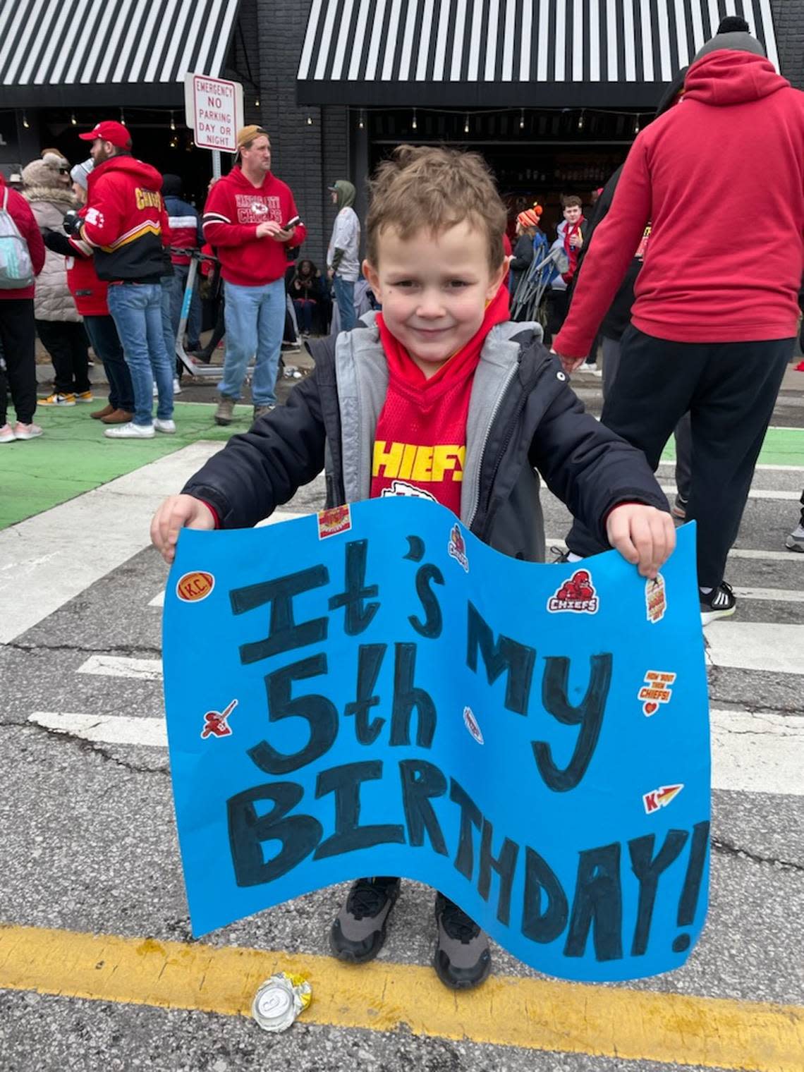 After multiple attempts, Cole Wilson was able to finish his sign shortly before the parade. He hoped it wouldl catch the eye of his heroes, Travis Kelce and Patrick Mahomes.