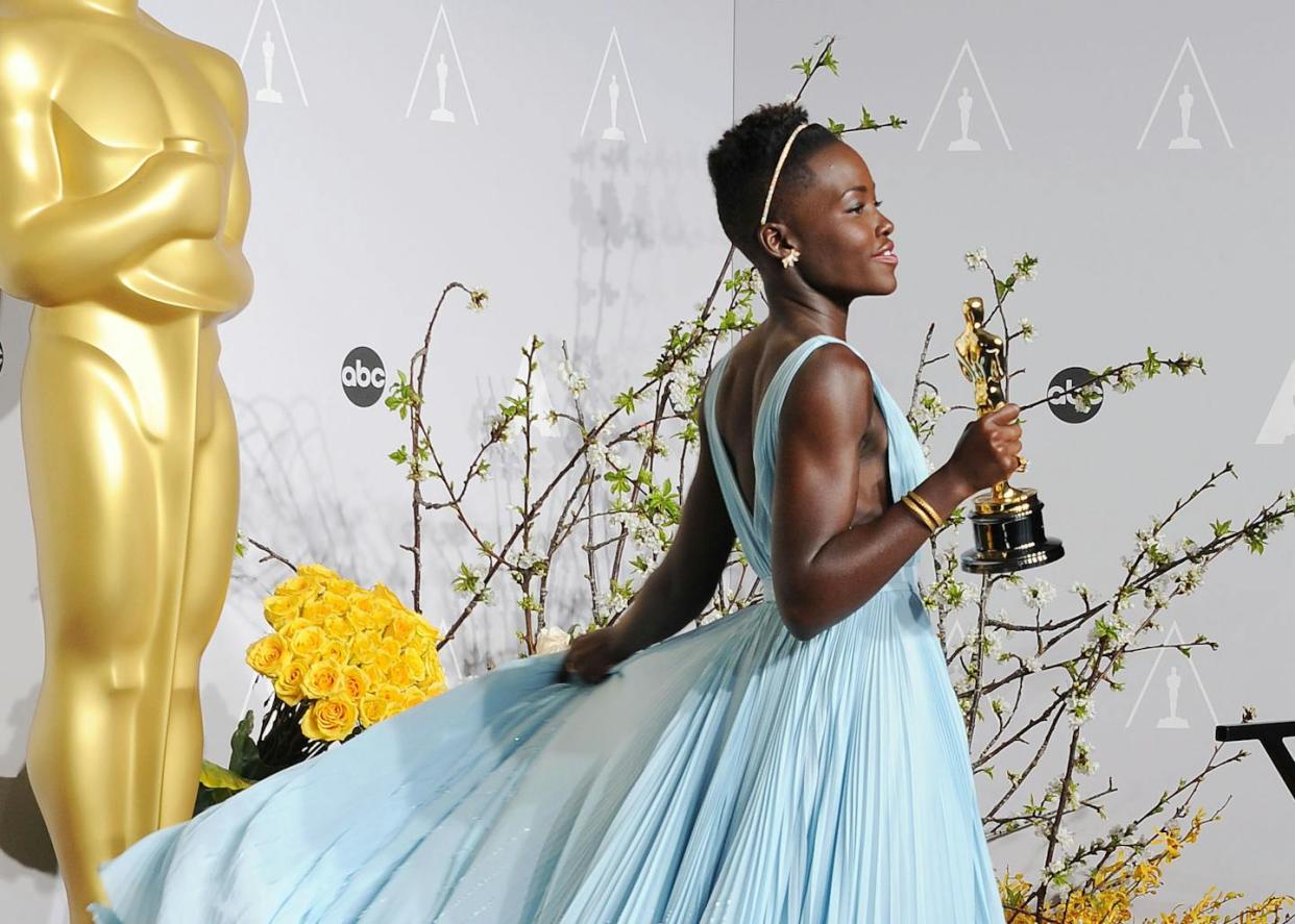 The dress actress Lupita Nyong'o wore to the 86th Academy Awards in 2014 became a story in and of itself. <a href="https://www.gettyimages.com/detail/news-photo/caactress-lupita-nyongo-poses-in-the-press-room-during-the-news-photo/478056305?adppopup=true" rel="nofollow noopener" target="_blank" data-ylk="slk:Jeffrey Mayer/WireImage via Getty Images;elm:context_link;itc:0;sec:content-canvas" class="link ">Jeffrey Mayer/WireImage via Getty Images</a>