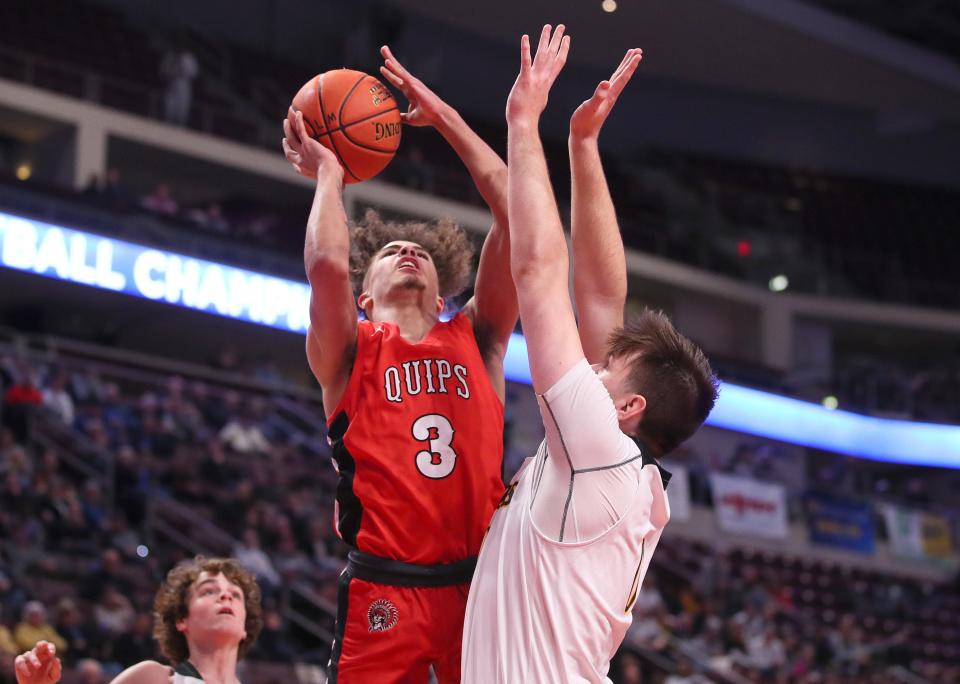 Aliquippa's Donovan Walker (3) goes for two points over the head of Lancaster Mennonite's David Weaver (0) during the second half of the PIAA 2A Championship game Friday afternoon at the Giant Center in Hershey, PA.